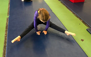 Child doing gymnastic stretch